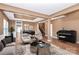 Inviting living area featuring modern furniture, a piano, and a view into the adjacent dining space at 5146 Elementary View Dr, Charlotte, NC 28269