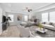 Beautifully staged main bedroom featuring a trey ceiling, natural light, and cozy sitting area at 5146 Elementary View Dr, Charlotte, NC 28269