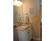 Well-lit bathroom vanity features granite countertops, framed mirror, and decorative hand towels at 5817 Wingate Hill Rd, Denver, NC 28037