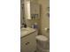 Well-lit bathroom with granite countertop, white cabinets, and modern fixtures, offering style and functionality at 5817 Wingate Hill Rd, Denver, NC 28037