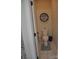 Cozy powder room with unique decorative shelf and a stylish patterned tile detail at the doorway at 5817 Wingate Hill Rd, Denver, NC 28037