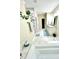 Bright bathroom with a large tub, vanity with double sinks, and modern fixtures at 5817 Wingate Hill Rd, Denver, NC 28037