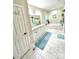 Elegant bathroom with double vanity, marble floors, and a soaking tub at 5817 Wingate Hill Rd, Denver, NC 28037