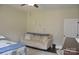 Bedroom featuring a bed, sofa, and wall decor, creating a comfortable and inviting space at 5817 Wingate Hill Rd, Denver, NC 28037