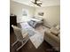 Cozy bedroom featuring a ceiling fan, area rug, and comfortable furnishings at 5817 Wingate Hill Rd, Denver, NC 28037
