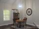Cozy dining area features a round table, four chairs, and decor at 5817 Wingate Hill Rd, Denver, NC 28037