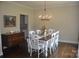 Dining room with a dining table, six chairs, and a wooden dresser at 5817 Wingate Hill Rd, Denver, NC 28037