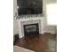 Elegant fireplace with a stone surround, perfect for cozy evenings in the living room at 5817 Wingate Hill Rd, Denver, NC 28037