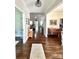 Inviting hallway with hardwood floors, neutral walls, and views into adjacent living spaces at 5817 Wingate Hill Rd, Denver, NC 28037