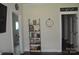 Inviting hallway with a decorative shelving unit and neutral decor at 5817 Wingate Hill Rd, Denver, NC 28037