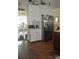 Spacious kitchen with wood floors, white cabinets, and stainless steel refrigerator at 5817 Wingate Hill Rd, Denver, NC 28037