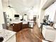 Open concept kitchen with island and eat in dining connects to living room for casual entertaining at 5817 Wingate Hill Rd, Denver, NC 28037