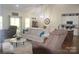 Spacious living room with hardwood floors, comfortable seating, and ample natural light at 5817 Wingate Hill Rd, Denver, NC 28037