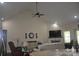 Bright living room with vaulted ceilings, fan, fireplace, television, and comfortable seating area at 5817 Wingate Hill Rd, Denver, NC 28037