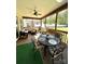 Relaxing covered porch with outdoor seating and a view of the backyard at 5817 Wingate Hill Rd, Denver, NC 28037