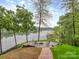 Inviting backyard patio with comfortable seating and stunning lake views, surrounded by mature trees at 5951 Johnson Rd, Clover, SC 29710