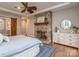 Cozy bedroom boasts stone fireplace and ensuite bathroom access at 5951 Johnson Rd, Clover, SC 29710