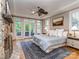 A primary bedroom with a stone fireplace and views to a rear deck at 5951 Johnson Rd, Clover, SC 29710