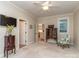 Spacious bedroom with wood hutch, floral chair, and a doorway to the kitchen area at 5951 Johnson Rd, Clover, SC 29710