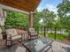 Deck featuring a glass table and chairs with views of the lake and a grassy lawn at 5951 Johnson Rd, Clover, SC 29710