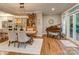 Dining room with a chandelier, hardwood floors, and an open layout to the kitchen at 5951 Johnson Rd, Clover, SC 29710