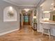 Inviting entryway featuring hardwood floors, stylish decor, and an open view into the kitchen at 5951 Johnson Rd, Clover, SC 29710