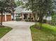 Charming home with manicured landscaping, covered porch and three car garage at 5951 Johnson Rd, Clover, SC 29710