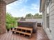 Exterior deck featuring a luxurious hot tub, perfect for relaxation and entertainment outdoors at 5951 Johnson Rd, Clover, SC 29710