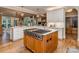 Open kitchen with a central island, hardwood floors, and modern appliances at 5951 Johnson Rd, Clover, SC 29710