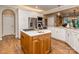 Bright kitchen features an island, stainless appliances, and hardwood floors at 5951 Johnson Rd, Clover, SC 29710