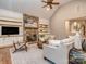 Spacious living room with stone fireplace, built-in shelving, and comfortable seating area at 5951 Johnson Rd, Clover, SC 29710