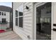 Balcony area featuring white siding and a view of neighboring houses on a sunny day at 6005 Countess Dr # 49, Charlotte, NC 28217