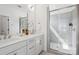Elegant bathroom with double vanity, modern fixtures, glass-enclosed shower, and neutral color scheme at 6005 Countess Dr # 49, Charlotte, NC 28217