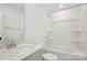 All-white bathroom features a combination shower and tub and modern fixtures at 6005 Countess Dr # 49, Charlotte, NC 28217