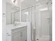 Bright bathroom with glass enclosed shower, modern vanity, and subway tile at 6005 Countess Dr # 49, Charlotte, NC 28217