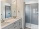 Bathroom with double vanity, large mirrors, and a glass-enclosed shower at 6005 Countess Dr # 49, Charlotte, NC 28217