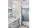 Modern bathroom with double sinks, quartz countertop and walk in shower at 6005 Countess Dr # 49, Charlotte, NC 28217