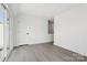 Bright bedroom features an oversized sliding door and neutral finishes at 6005 Countess Dr # 49, Charlotte, NC 28217