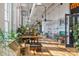 Bright and airy common area with tables, plants, and natural light, creating a welcoming and relaxing atmosphere at 6005 Countess Dr # 49, Charlotte, NC 28217