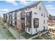 Modern townhome row with eye-catching architectural details, neutral color schemes, and inviting curb appeal at 6005 Countess Dr # 49, Charlotte, NC 28217