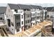 Townhome exterior showing modern design with mixed materials and large windows at 6005 Countess Dr # 49, Charlotte, NC 28217