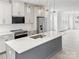 Modern kitchen with white cabinets, stainless steel appliances and quartz countertops at 6005 Countess Dr # 49, Charlotte, NC 28217