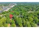 Aerial view featuring the property's location marked with a pin, surrounded by a green canopy at 6338 Rosecrest Dr, Charlotte, NC 28210
