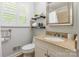 Bathroom featuring granite countertop vanity and neutral paint at 6338 Rosecrest Dr, Charlotte, NC 28210