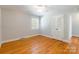 Spacious bedroom with hardwood floors, closet, natural light and ceiling fan at 6338 Rosecrest Dr, Charlotte, NC 28210