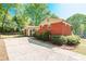 Charming single-Gathering home with a brick exterior, mature landscaping, and a long driveway at 6338 Rosecrest Dr, Charlotte, NC 28210