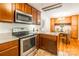 View of kitchen and dining nook featuring granite counters and stainless steel appliances at 6338 Rosecrest Dr, Charlotte, NC 28210