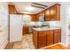 Traditional kitchen with cherry cabinets, granite counters, stainless appliances, and tile flooring at 6338 Rosecrest Dr, Charlotte, NC 28210