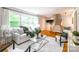 Bright living room with hardwood floors, comfortable seating, and ample natural light at 6338 Rosecrest Dr, Charlotte, NC 28210