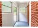 Mud Room with a painted floor and multiple windows at 6338 Rosecrest Dr, Charlotte, NC 28210